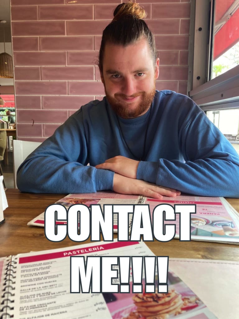 Seth smiling at a table